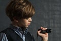 Portrait image of a little boy with a wrist watch