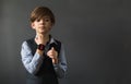 Portrait image of a little boy with a wrist watch