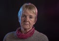 Portrait image of a mature woman on a black background