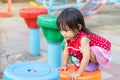 Portrait image of 1-2 years old of baby. Happy Asian child girl climbing and playing the toy at the playground. She enjoy and smil Royalty Free Stock Photo