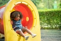 Portrait image of 1-2 yeas old girl.  Happy Asian child girl happy playing outdoor. She playing with slider bar toy at the Royalty Free Stock Photo