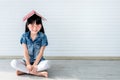 Asian girl is 5 year old, smile, wearing glasses with a book on her head Royalty Free Stock Photo