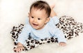 Portrait images of Cute little boy lying on the floor, smiling with good mood
