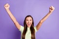 Portrait of impressed person fists up open mouth scream yeah won good mood isolated on purple color background Royalty Free Stock Photo