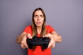 Portrait of impressed worried girl play video game dont want lose feel focused wear good looking clothing isolated over Royalty Free Stock Photo