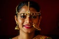 Portrait indian beautiful female in golden rich jewelery and tradition saree face closeup professional make-up wearing Royalty Free Stock Photo