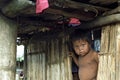 Portrait of Indian boy in poor hut of bamboo Royalty Free Stock Photo