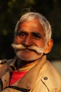 Portrait of an Indian male with a fancy moustache.