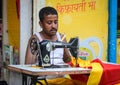 Portrait of Indian man tailor at work place