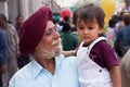 Portrait of indian man with young boy walking at Chandni Chowk,