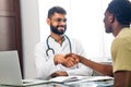 Portrait of indian man doctor talking to patient on consultation Royalty Free Stock Photo