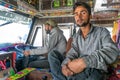 The portrait of indian truck driver and his helper