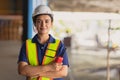 Portrait Indian woman worker supervisor smart confident look with engineer safety suit work in large factory warehouse industry Royalty Free Stock Photo