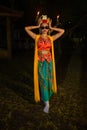 a portrait of an Indonesian dancer with jasmine dangling in her hair adorns her beautiful appearance on stage