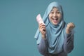 Indonesian Muslim Woman Holding Rupiah Money