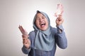 Indonesian Muslim Woman Holding Rupiah Money Royalty Free Stock Photo