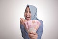 Indonesian Muslim Woman Holding Rupiah Money