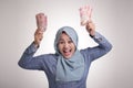 Indonesian Muslim Woman Holding Rupiah Money