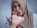 Muslim Woman Rejecting Bribery Money Royalty Free Stock Photo