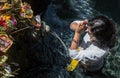 Portrait of an indonesian woman praying.