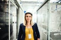 A portrait of an industrial woman engineer standing in a factory. Royalty Free Stock Photo