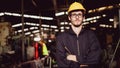 Portrait of an industrial worker standing with arms crossed feeling proud and confident looking for the new opportunity, new