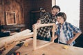 Portrait inspired child boy positive cheerful daddy craftsmen occupation workstation masterclass hardwood desktop desk