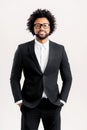 Portrait of inteligente handsome african-american businessman in formal wear and stylish eyeglasses standing with hands