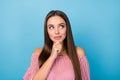 Portrait of interested woman touch her chin hand look copyspace wear modern shirt isolated over blue color background