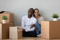 Portrait of international couple moving to new house together