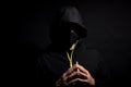 Portrait of Invisible man hacker in the hood isolated on black background Royalty Free Stock Photo