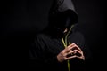 Portrait of Invisible man hacker in the hood isolated on black background Royalty Free Stock Photo