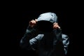 Portrait of Invisible man in the hood on black background