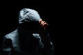 Portrait of Invisible man in the hood on black background Royalty Free Stock Photo