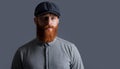 Portrait of Irish man isolated on grey. Bearded man with serious face. Unshaven man with red beard Royalty Free Stock Photo
