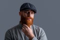 Portrait of Irish man. Serious man stroking red beard. Bearded man with unshaven face studio Royalty Free Stock Photo