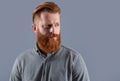 Portrait of Irish man looking aside. Serious man with red beard. Bearded man with unshaven face Royalty Free Stock Photo