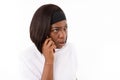 Portrait of irritated young woman talking on mobile phone Royalty Free Stock Photo