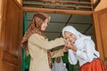 Portrait of islamic school students kissing the teacher`s hand