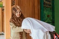 Portrait of islamic school students kissing the teacher`s hand