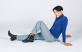 Portrait isolated cutout studio full body Asian young sexy slim fashionable LGBTQ gay male model in turtleneck long sleeve shirt Royalty Free Stock Photo
