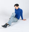 Portrait isolated cutout studio full body Asian young sexy slim fashionable LGBTQ gay male model in turtleneck long sleeve shirt Royalty Free Stock Photo