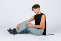 Portrait isolated cutout studio shot of Asian young sexy luxury glamour slim fashionable LGBTQ gay male model in black no sleeve Royalty Free Stock Photo