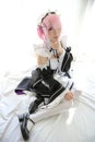 Portrait of Japan anime cosplay woman , white japanese maid in white tone room