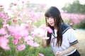 Portrait of Japanese school girl uniform with pink cosmos flower Royalty Free Stock Photo