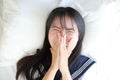 Portrait japanese school girl in white tone bed room