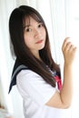 Portrait japanese school girl in white tone bed room