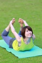 Portrait of Japanewe woman doing yoga frog pose Royalty Free Stock Photo