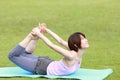 Portrait of Japanewe woman doing yoga frog pose Royalty Free Stock Photo