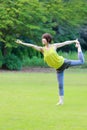 Portrait of Japanewe woman doing yoga Lord of the Dance Pose Royalty Free Stock Photo